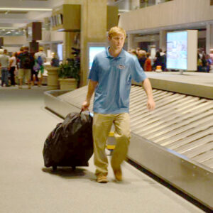 Sand Rider beach wheelchair inside a wheeled travel bag at airport