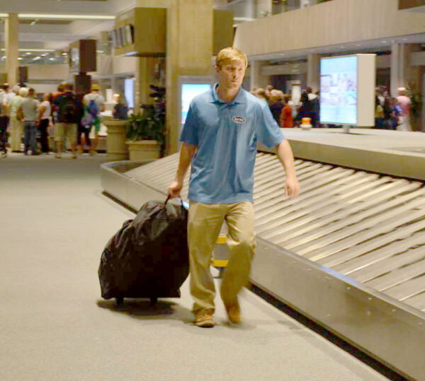 Sand Rider beach wheelchair inside a wheeled travel bag at airport