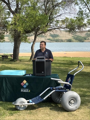 Saskatchewan Parks, Culture and Sport Minister Ken Chevelday announcing addition of 5 wheelchairs