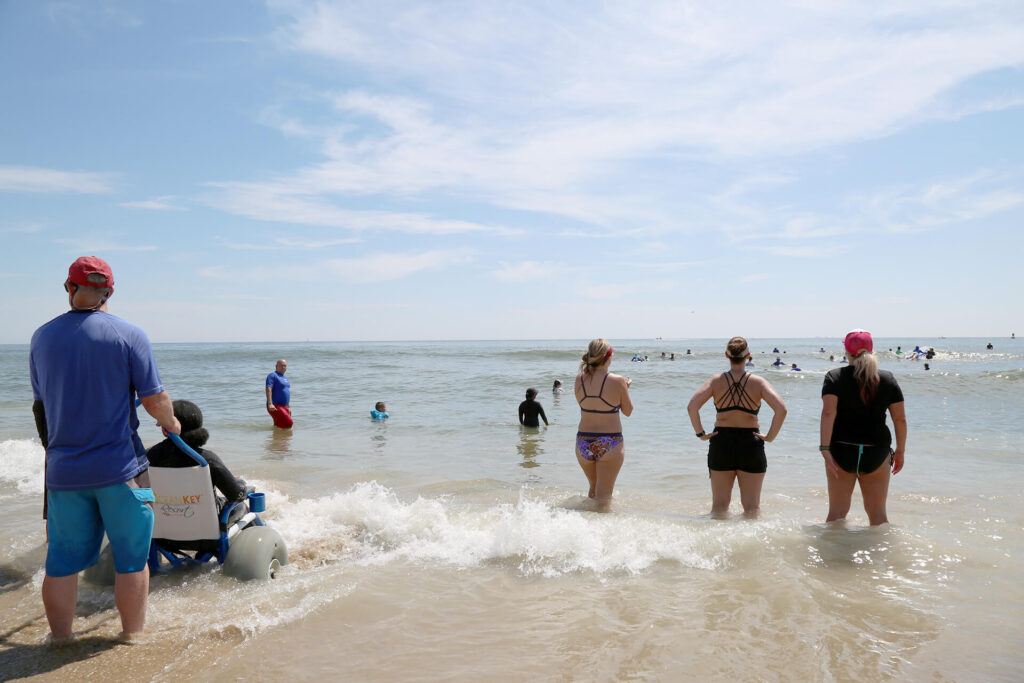 Sand Rider beach wheelchair in the water at the beach